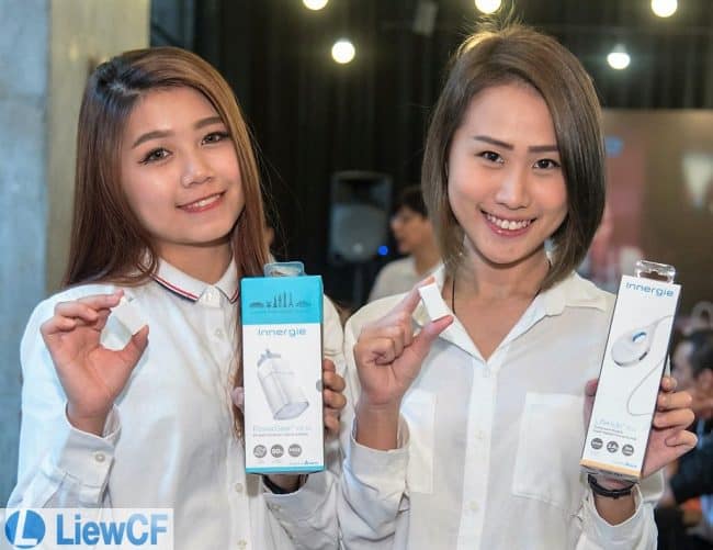 Models displaying Innergie's PowerGear ICE 65, WizardTip, and LifeHub Plus